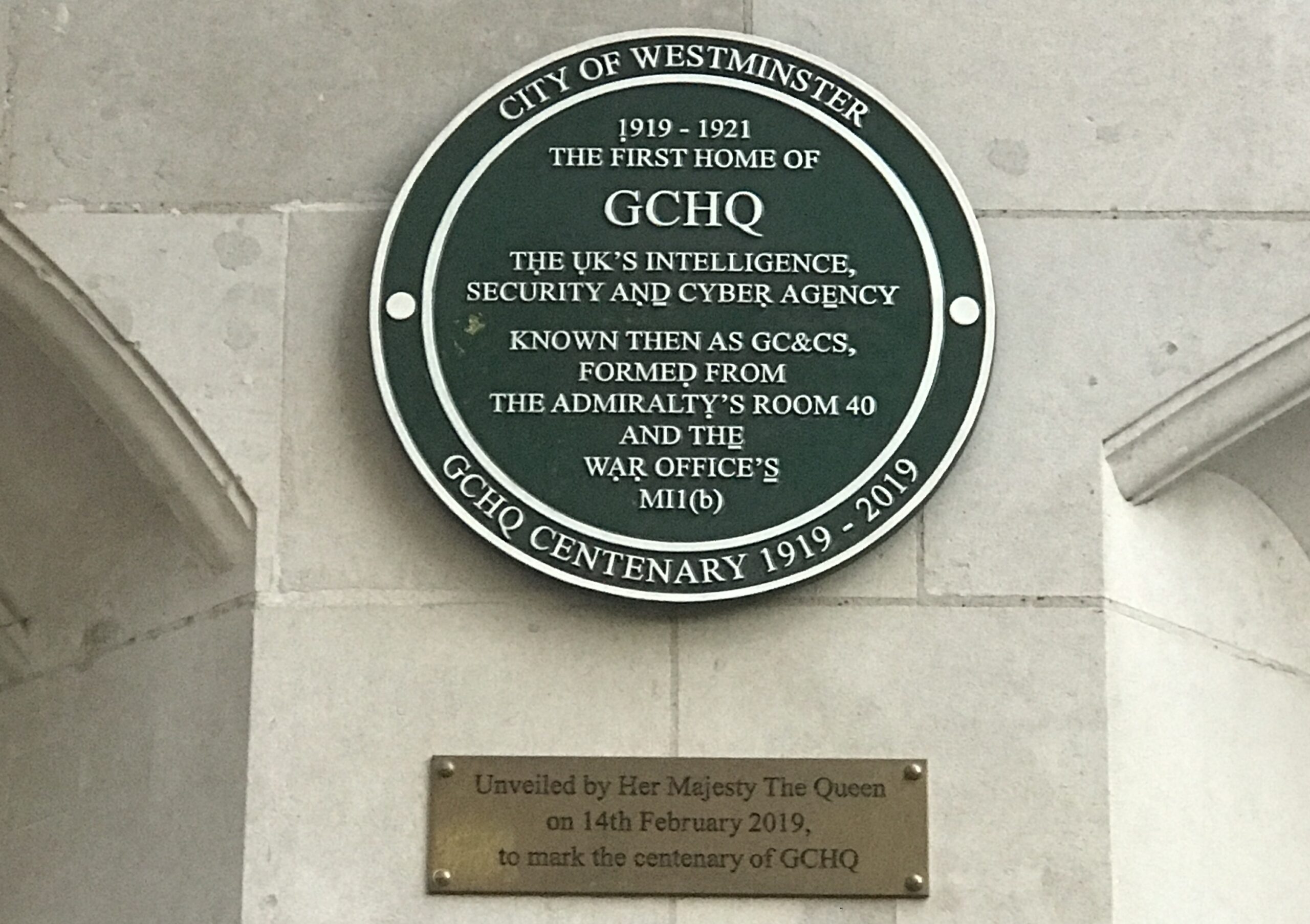 green plaque commemorating first site of GC+CS