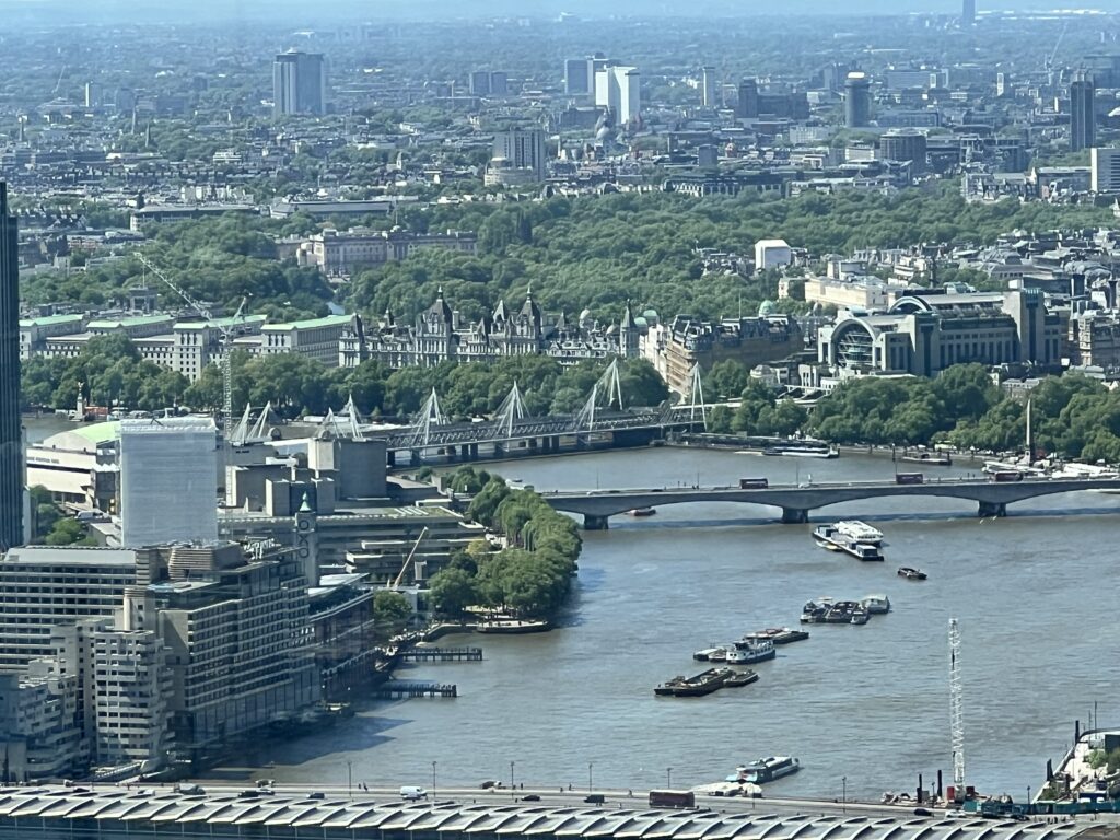 view down the thames of waterloo bridge and buckingham palace